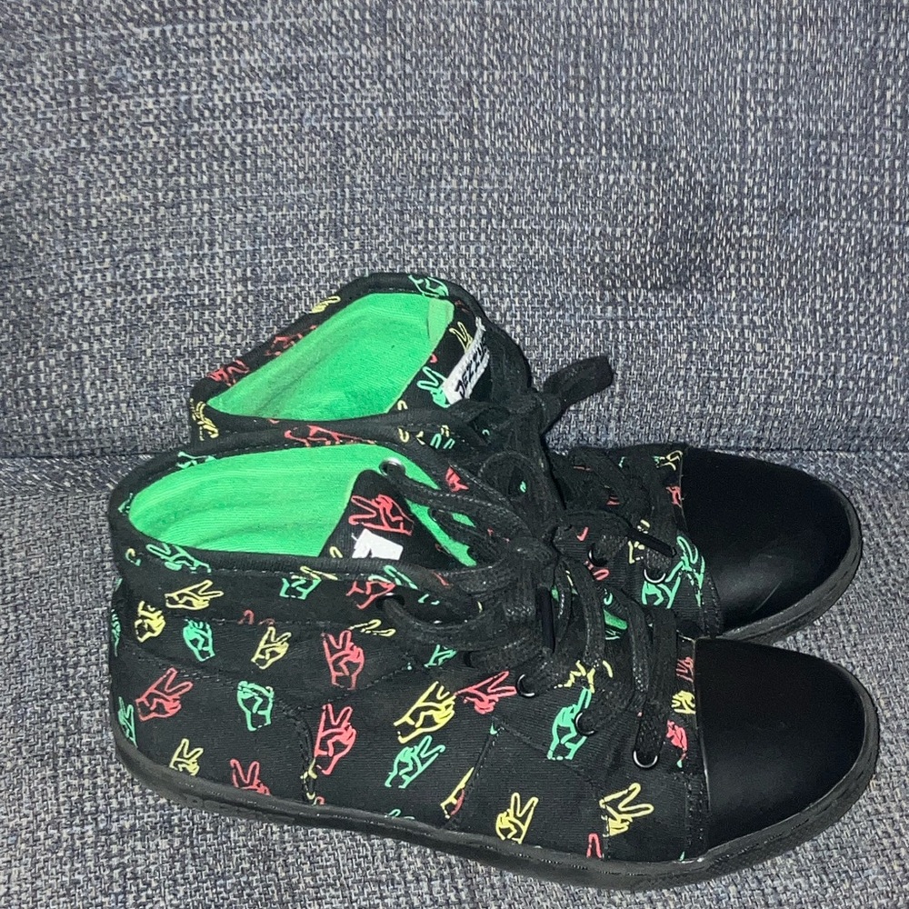 Vibrant Black and Green Slip-On Sneakers with Playful Pattern